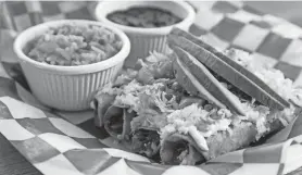  ?? ?? At El Guacamole in Asbury Park, tacos dorados are fried corn tortillas with chicken or steak, sour cream, cheese, lettuce, avocado and tomato.