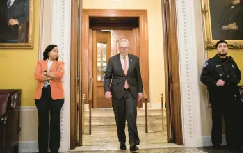  ?? NATHAN HOWARD/GETTY ?? Senate Majority Leader Chuck Schumer, D-N.Y., exits the Senate chamber Saturday in Washington.