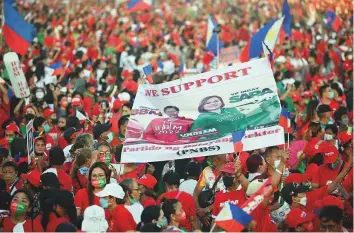  ?? AFP ?? Supporters of Ferdinand Marcos Jr. and his running mate Sara Duterte, daughter of President Rodrigo Duterte, gather for a campaign rally in Paranaque City, suburban Manila, yesterday.