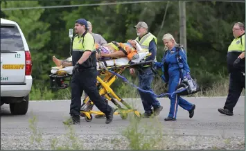  ?? Photos by Penny Hopkins Chanler ?? Medical responders: Medical personnel attend to one of the injured workers who was hurt during a crane accident at the Ouachita River Bridge on Thursday. One employee was flown to Little Rock while the other was taken to the Medical Center of South...