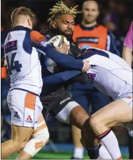  ??  ?? Niko Matawalu is stopped by Darcy Graham