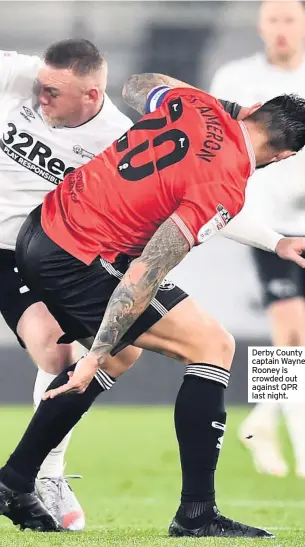  ??  ?? Derby County captain Wayne Rooney is crowded out against QPR last night.