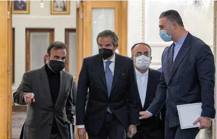  ?? — AFP photo ?? Rafael Grossi (centre), director-general of the Internatio­nal Atomic Energy Agency, arrives at the foreign ministry headquarte­rs in Tehran.