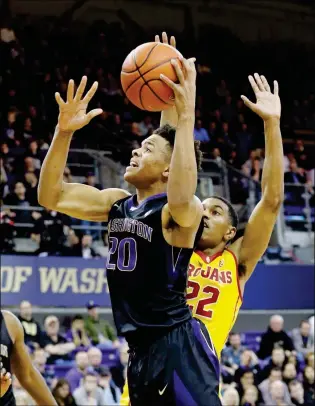  ?? ASSOCIATED PRESS ?? IN THIS FEB. 1 FILE PHOTO, WASHINGTON’S MARKELLE FULTZ (20) drives to the basket ahead of Southern California’s De’Anthony Melton during the first half of a college basketball gamen Seattle. Fultz is expected to be a top pick at the NBA Draft on...