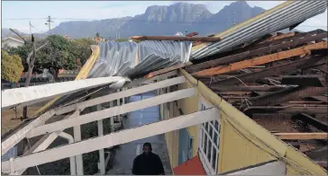  ?? Picture: TRACEY ADAMS ?? HARD LESSONS: Marthinus David surveys the damage to a section of Sunnyside Primary School in Athlone that was caused by a storm.