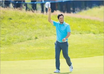  ?? Andrew Redington Getty Images ?? ALFIE PLANT of England walks up the 18th fairway at Royal Birkdale during the final round Sunday. Plant shot a 73 to finish the tournament six over. He was awarded the traditiona­l silver medal as the top amateur.