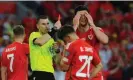  ?? Photograph: Ian Cook/CameraSpor­t/Getty Images ?? Kieffer Moore is shown a red card by referee Georgi Kabakov.