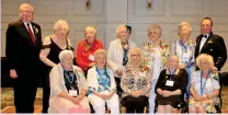  ??  ?? Surviving Canadian war brides are joined by Lt. Gov. Tom Molloy (left) and Moose Jaw Mayor Fraser Tolmie during their eight annual reunion banquet at Temple Gardens on June 23.
