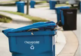  ?? VIRGINIAN-PILOT BILLY SCHUERMAN/THE ?? Residents of Chesapeake have had problems with recycling collection since May. The recycling contract was canceled and bin contents will be disposed of as trash.