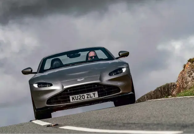  ??  ?? Above left: open air is yours in under seven seconds. Right: Roadster gets 400mm discs at the front, 360mm at the rear. Below right: Amg-sourced 4-litre V8 develops the same 503bhp and 505lb ft as in the coupe