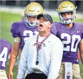  ??  ?? Christian Brothers coach Thomas McDaniel runs his team through drills Monday. MARK WEBER/THE COMMERCIAL APPEAL