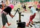  ??  ?? In this photo taken on Jan 7, 2014, displaced members of the Rengma Naga tribe use a hand pump at a relief camp