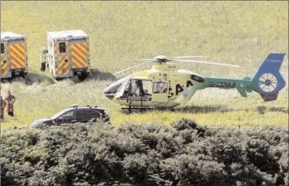  ?? The Associated Press ?? Emergency personnel arrive at the scene of a train derailment in Scotland where three people were killed and six others injured, Wednesday.