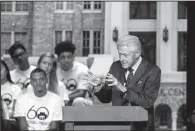  ?? Arkansas Democrat-Gazette/MITCHELL PE MASILUN ?? Former President Bill Clinton addresses a crowd of nearly 2,000 people Monday at Little Rock Central High.