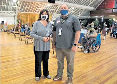  ?? DANIELLE RAY / SENTINEL & ENTERPRISE ?? Fitchburg Veterans Commission­er Michele Marino with Jeremy Garland, Health Systems Specialist for the VA Central Western Massachuse­tts Healthcare System, at the veteran vaccine clinic held Tuesday at the Senior Center.