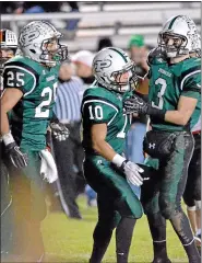  ?? MEDIANEWS GROUP FILE PHOTO ?? Pennridge’s John Kim (10) is congratult­ated by teammates Micah Stutzman (3) and Mike Class (25) after his touchdown against Pennsbury during first-half action of their playoff contest at Poppy Yoder Field on Friday November 16,2012.