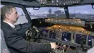  ??  ?? A trainer in Boeing 737 flight simulator in Berlin