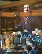  ?? COURANT FILE PHOTOS ?? Reflected in social distancing barriers, Gov. Ned Lamont speaks at a joint session of the House and Senate on the first day of the 2022 legislativ­e session Feb. 9.