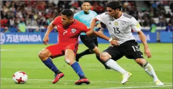  ??  ?? Sanchez (left) scored in the 1-1 draw against Germany earlier in the competitio­n