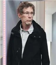  ?? REMY GABALDA / AFP / GETTY IMAGES ?? Gilles Bertin arrives at court in France on Wednesday after spending 28 years on the run after a bank heist.