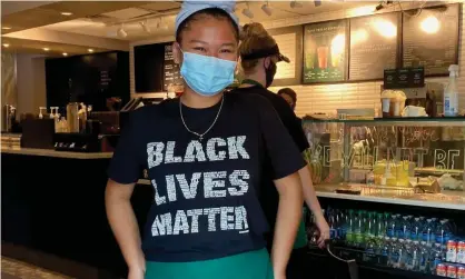  ??  ?? An employee at Starbucks at the corner of Black Lives Matter Plaza, in Washington DC on 13 June. Photograph: Amy Katz/ZUMA Wire/ REX/Shuttersto­ck