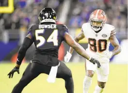  ?? NICK WASS/AP ?? Browns wide receiver Jarvis Landry runs a route against Ravens outside linebacker Tyus Bowser during a game in November in Baltimore. Landry was one of the leading candidates to help the Ravens’ offense, but he reportedly signed a one-year deal with the New Orleans Saints on Friday.