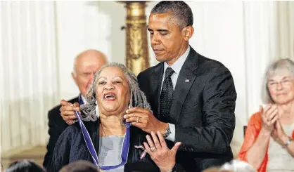  ?? KEVIN LAMARQUE/REUTERS ?? U.S. President Barack Obama awards novelist Toni Morrison a 2012 Presidenti­al Medal of Freedom during a ceremony in the East Room of the White House in Washington.