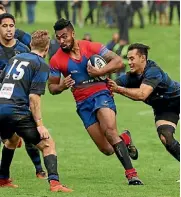  ??  ?? Suburbs fullback Lolagi Visinia charges into fellow Auckland Blues squad member, Jordan Trainor.