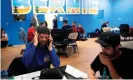  ??  ?? Phone bank volunteers call potential voters from Bernie Sanders’ Colorado campaign office on 3 March. Photograph: Jason Connolly/AFP via Getty Images