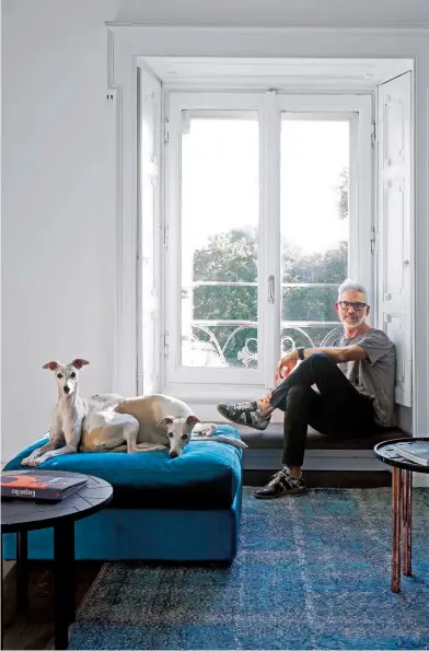  ??  ?? BOLD STROKESVar­ious shades of teal complement each other in the living area, accented with pops of bright colour and metallics. Samer Alameen with his greyhounds, Diana and Freccia.