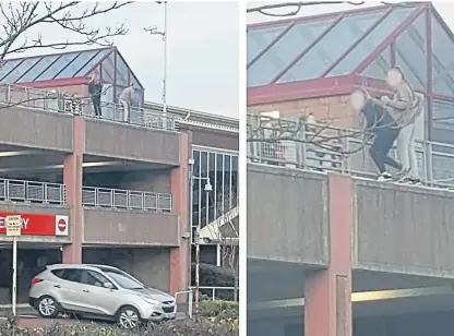  ??  ?? Teenage girls hanging over the railings at the multi-storey car park at the Kingdom Centre in Glenrothes. The incident took place on Sunday November 4.