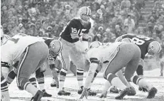  ?? AP PHOTO/FILE ?? Green Bay’s Bart Starr calls signals in bitter cold, and he later scored the winning touchdown on a 1-yard sneak with only seconds to play.