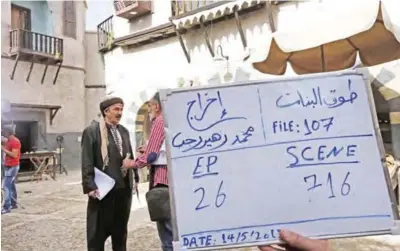  ??  ?? Syrian artist Rashid Assaf (left) is seen on the filming set of television series ‘Tawq Al-Banat’ in the village of Yaafur.