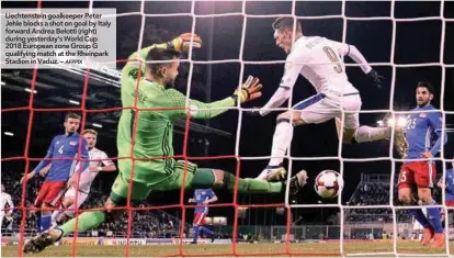  ??  ?? Liechtenst­ein goalkeeper Peter Jehle blocks a shot on goal by Italy forward Andrea Belotti (right) during yesterday’s World Cup 2018 European zone Group G qualifying match at the Rheinpark Stadion in Vaduz. –