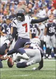  ?? Steven Senne / Associated Press ?? Houston Texans kicker Ka’imi Fairbairn (7) kicks while under pressure from New England Patriots cornerback Jonathan Jones (31), bottom right, during the first half on Sunday in Foxborough, Mass.