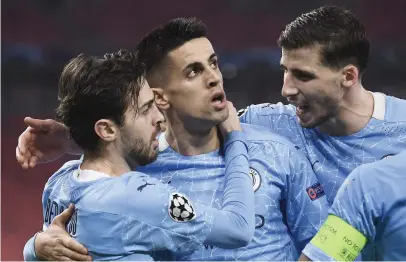  ?? Picture: AFP ?? GREAT FINISH. Manchester City’s Bernardo Silva (left) celebrates with team-mates after scoring a goal during the first leg of their Champions League last-16 match against Borussia Moenchengl­adbach in Budapest on Wednesday night.