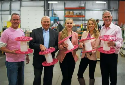  ?? SUBMITTED PHOTO ?? Allied Wire &amp; Cable recently donated $50,000 to the National Breast Cancer Foundation. Most of the money was raised during a week-long fundraiser. Shown here left to right with the company’s pink reels are: Allied’s Dan Flynn; state Sen. Bob Mensch; Danae Johnson and Kara Causey of the National Breast Cancer Foundation and Tim Flynn, Allied Wire &amp; Cable CEO.