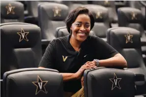  ?? The Associated Press ?? ■ Vanderbilt Athletic Director Candice Lee sits in a meeting room in the school’s athletic administra­tion office building June 8 in Nashville, Tenn.