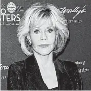  ?? JOE SCARNICI/GETTY 2018 ?? “We need you to be in shape in the upcoming race,” Jane Fonda tells viewers of her celebrity-filled exercise video.