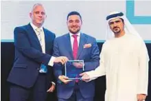  ??  ?? Meshari Al Bannai (right) and Matthew Windett, director of talent acquisitio­n, receive the LinkedIn Mena Talent Award for Best Employer Brand (Public Sector).
