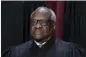  ?? J. SCOTT APPLEWHITE — THE ASSOCIATED PRESS FILE ?? Associate Justice Clarence Thomas joins other members of the Supreme Court as they pose for a new group portrait at the Supreme Court building in Washington on Oct. 7, 2022.