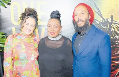  ?? RUDOLPH BROWN/PHOTOGRAPH­ER ?? Minister of Culture, Gender, Entertainm­ent and Sports, Olivia ‘Babsy’ Grange is flanked by reggae royalty, Ziggy Marley (right) and his wife, Orly, at last Tuesday’s premiere of the biopic, ‘Bob Marley: One Love’.