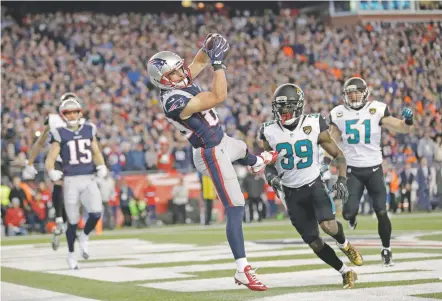  ?? DAVID J. PHILLIP/THE ASSOCIATED PRESS ?? Patriots wide receiver Danny Amendola caught two-fourth quarter touchdowns to complete New England’s rally and beat the Jaguars 24-20 on Sunday in Foxborough, Mass., to win the AFC championsh­ip.