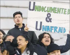  ?? Jeff Chiu Associated Press ?? LORDES REBOYOSO, right, at a 2017 immigrant-rights rally in San Francisco. L.A. joins Boston and other left-leaning cities to affirm their cities as sanctuarie­s.