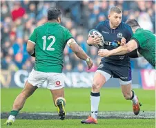  ??  ?? Finn Russell makes a break against Ireland.