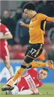  ??  ?? Boro’s Mo Besic challenges Wolves scorer Helder Costa.