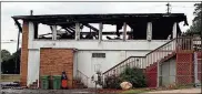  ?? Doug Walker / RN-T ?? Fire early Saturday morning destroyed the upper level of the clubhouse at the Callier Springs Country Club.
