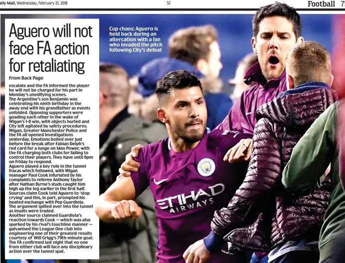  ??  ?? Cup chaos: Aguero is held back during an altercatio­n with a fan who invaded the pitch following City’s defeat