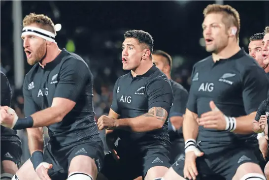  ??  ?? Codie Taylor performs the haka between Richie McCaw and Kieran Read. And, right, charges to the line to score against Namibia yesterday.