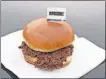  ?? [THE ASSOCIATED PRESS FILE PHOTO] ?? The Impossible Burger is a plant-based burger containing wheat protein, coconut oil and potato protein among it’s ingredient­s. Growing demand for healthier, more sustainabl­e food is one reason people are seeking plant-based “meats.”